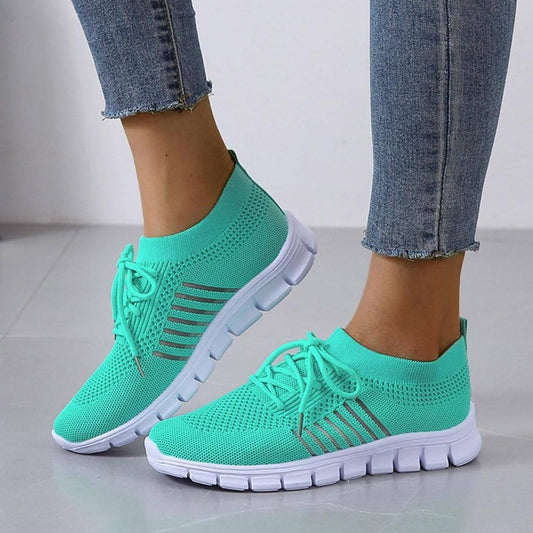 Baskets en maille respirante turquoise avec semelle amortissante – légères et élégantes pour un confort optimal.